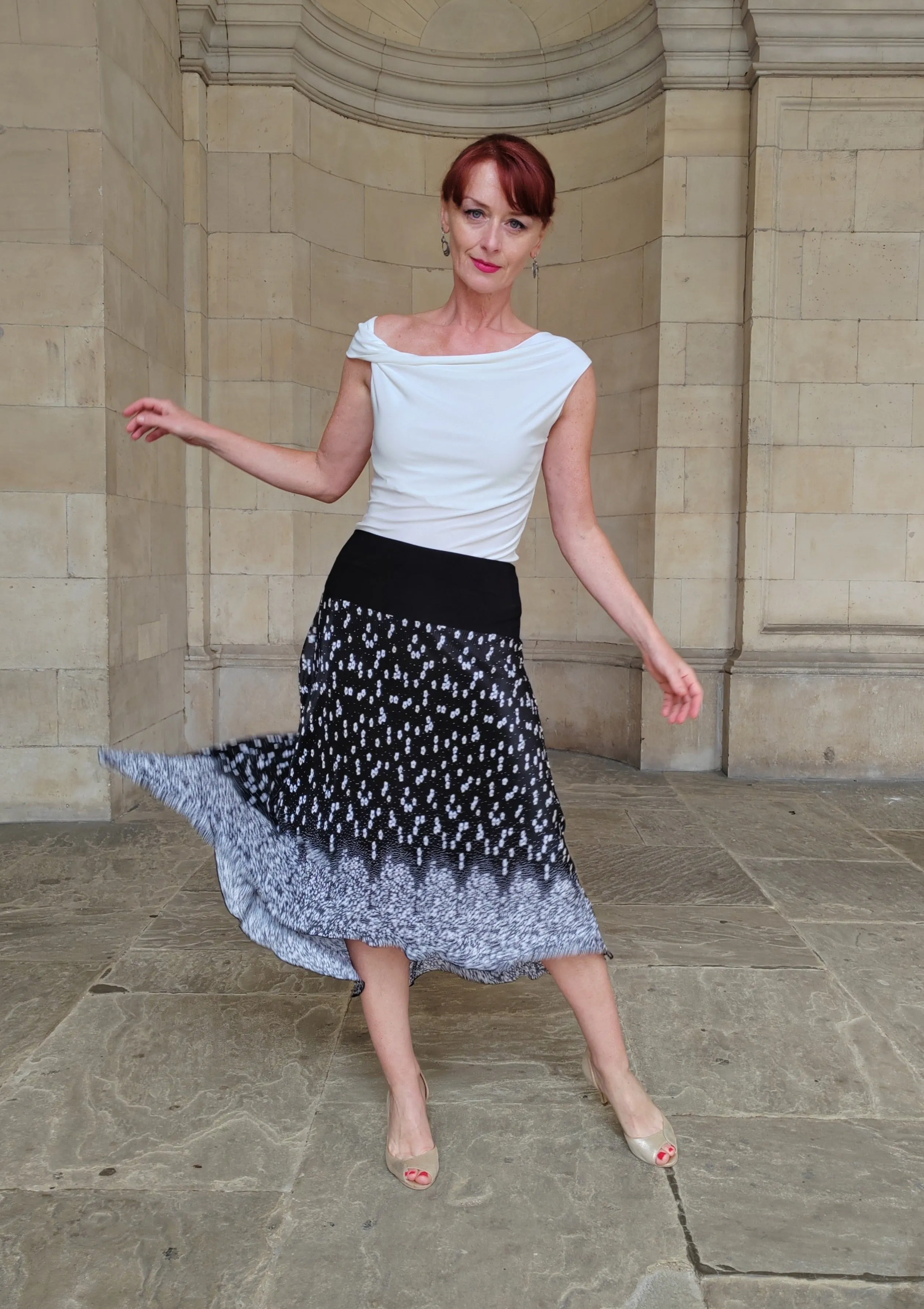 PLEATED SKIRT with decorative Border Print