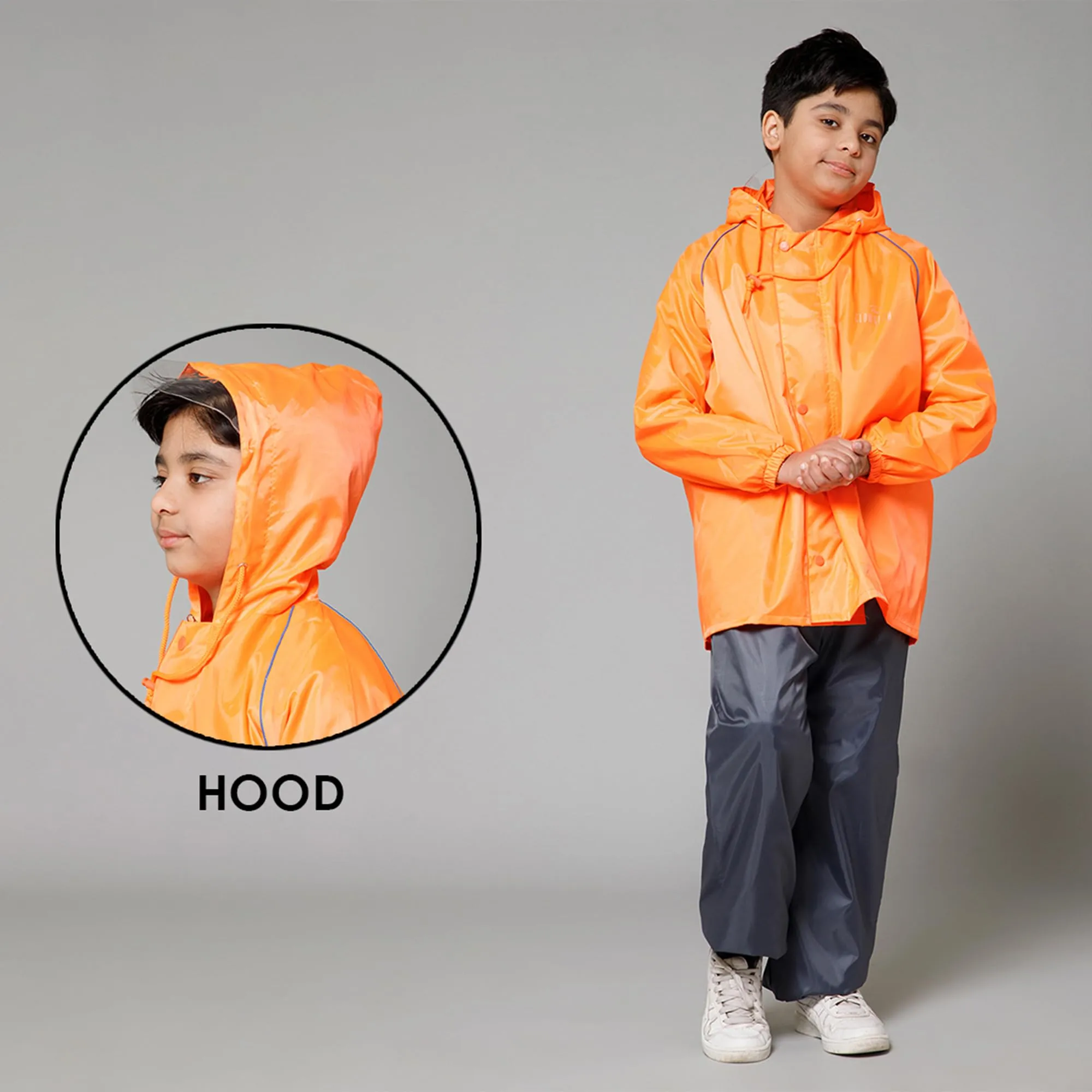 THE CLOWNFISH Duke Series Kids Waterproof Polyester Double Coating Reversible Raincoat with Hood and Reflector Logo at Back. Set of Top and Bottom. Printed Plastic Pouch. Kid Age-11-13 years (Orange)