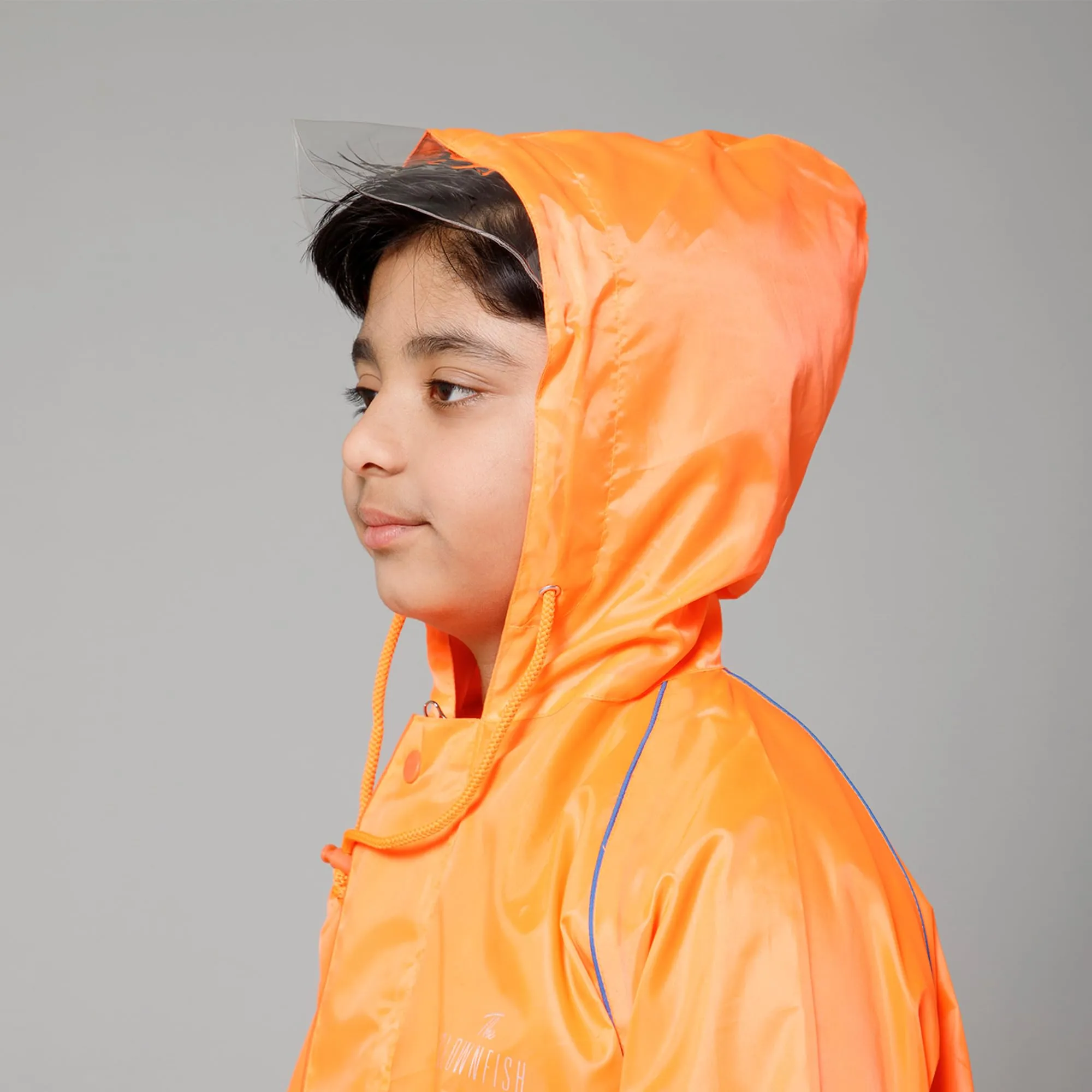 THE CLOWNFISH Duke Series Kids Waterproof Polyester Double Coating Reversible Raincoat with Hood and Reflector Logo at Back. Set of Top and Bottom. Printed Plastic Pouch. Kid Age-11-13 years (Orange)