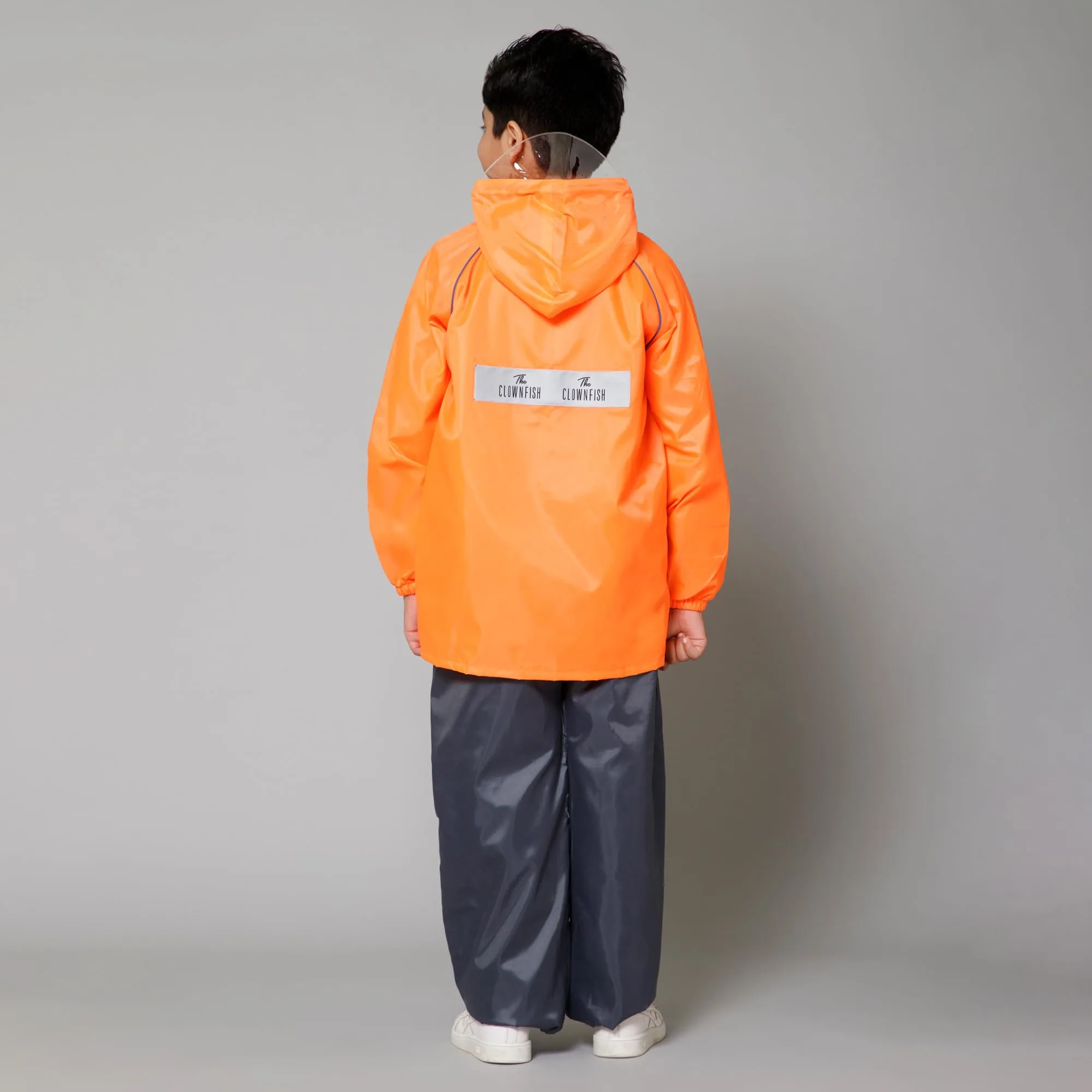 THE CLOWNFISH Duke Series Kids Waterproof Polyester Double Coating Reversible Raincoat with Hood and Reflector Logo at Back. Set of Top and Bottom. Printed Plastic Pouch. Kid Age-11-13 years (Orange)