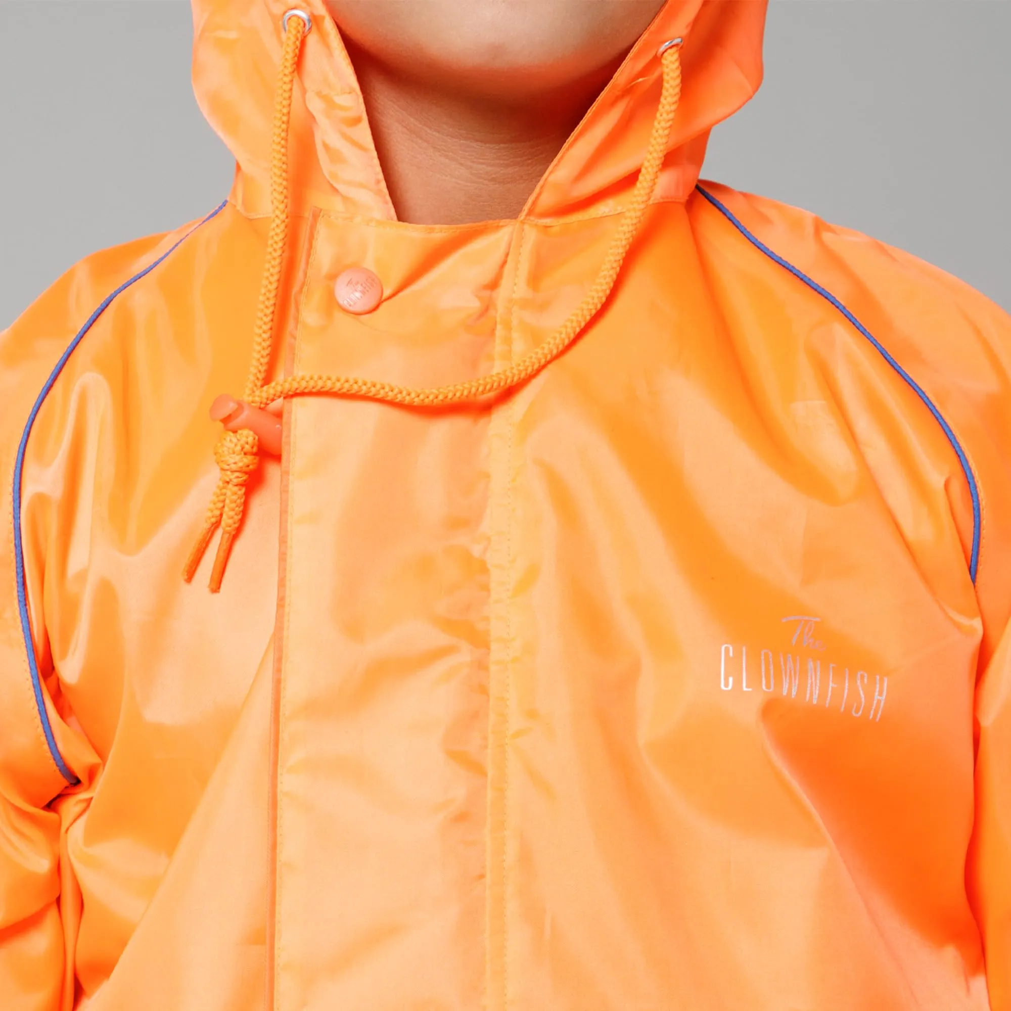 THE CLOWNFISH Duke Series Kids Waterproof Polyester Double Coating Reversible Raincoat with Hood and Reflector Logo at Back. Set of Top and Bottom. Printed Plastic Pouch. Kid Age-11-13 years (Orange)