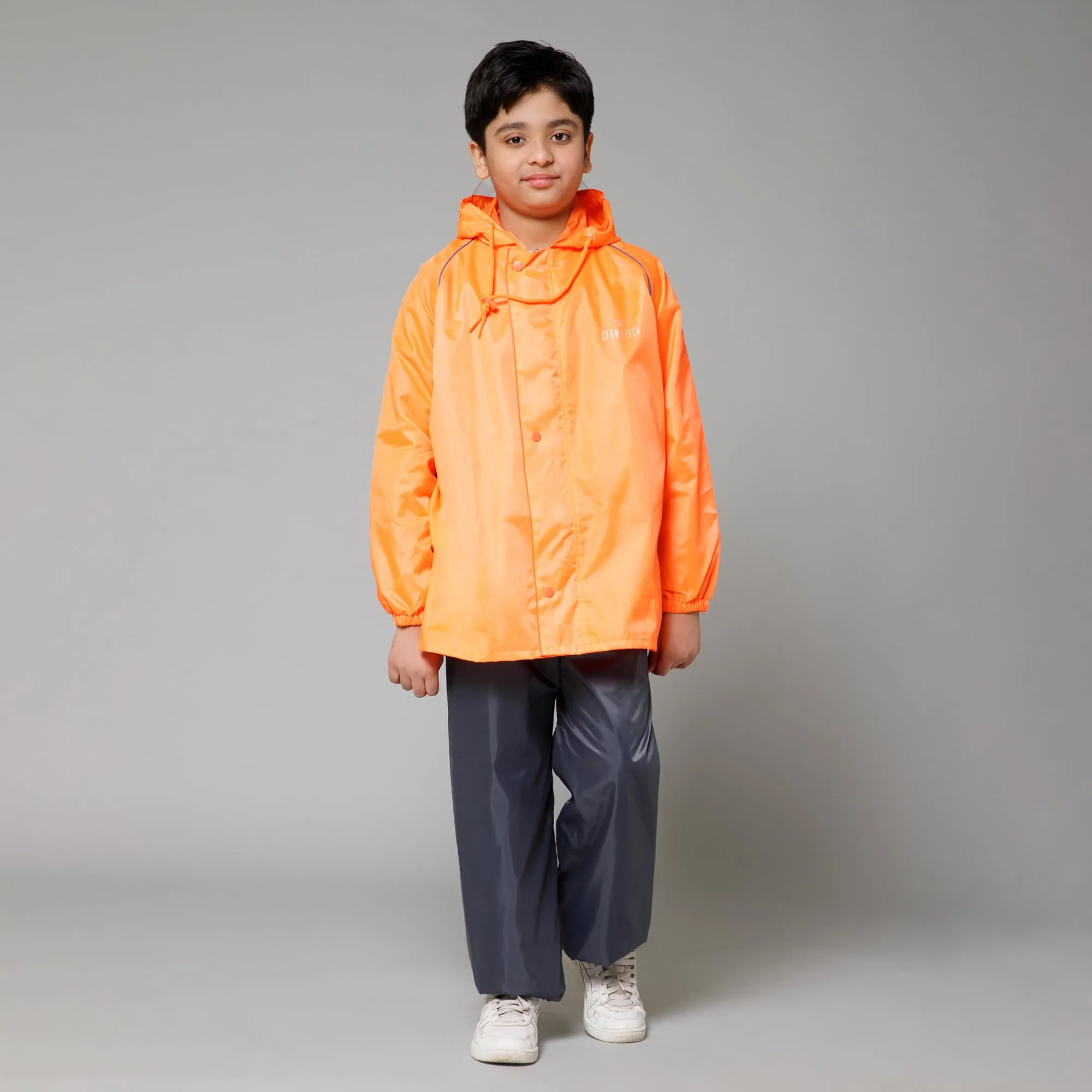 THE CLOWNFISH Duke Series Kids Waterproof Polyester Double Coating Reversible Raincoat with Hood and Reflector Logo at Back. Set of Top and Bottom. Printed Plastic Pouch. Kid Age-11-13 years (Orange)