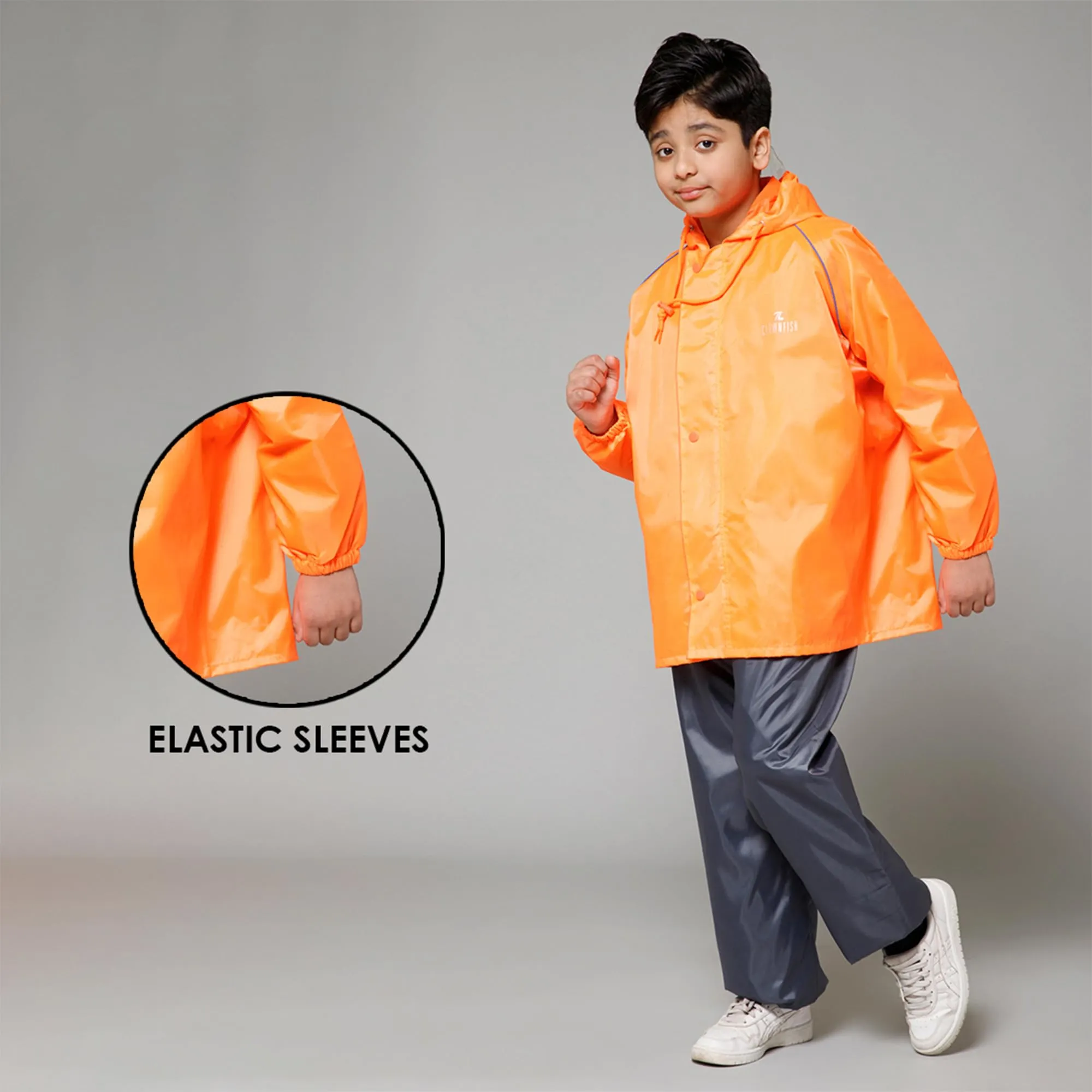 THE CLOWNFISH Duke Series Kids Waterproof Polyester Double Coating Reversible Raincoat with Hood and Reflector Logo at Back. Set of Top and Bottom. Printed Plastic Pouch. Kid Age-11-13 years (Orange)