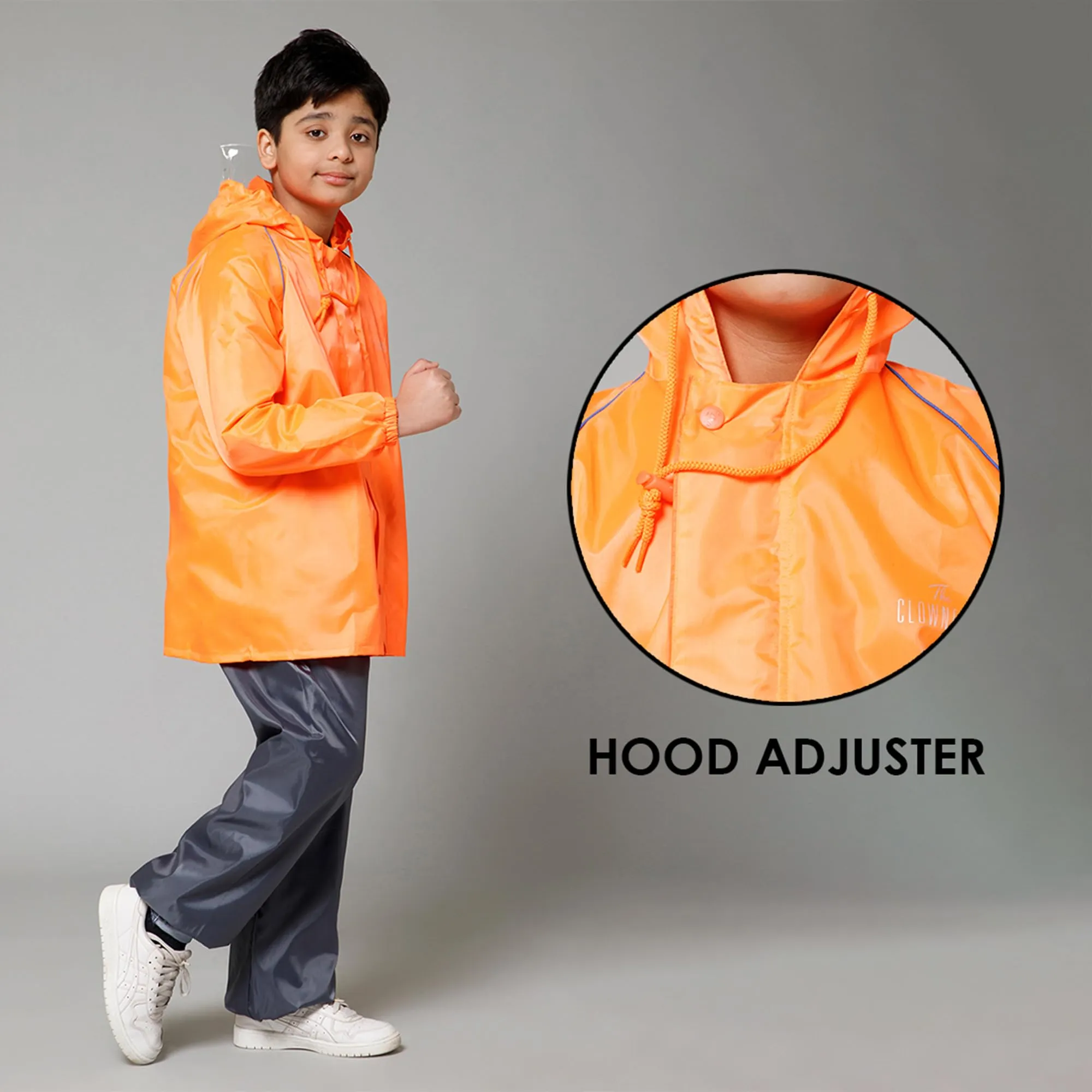 THE CLOWNFISH Duke Series Kids Waterproof Polyester Double Coating Reversible Raincoat with Hood and Reflector Logo at Back. Set of Top and Bottom. Printed Plastic Pouch. Kid Age-11-13 years (Orange)